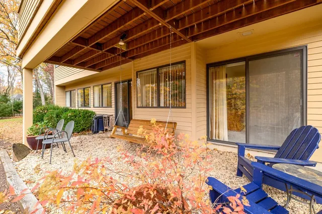 a porch with yard and outdoor seating