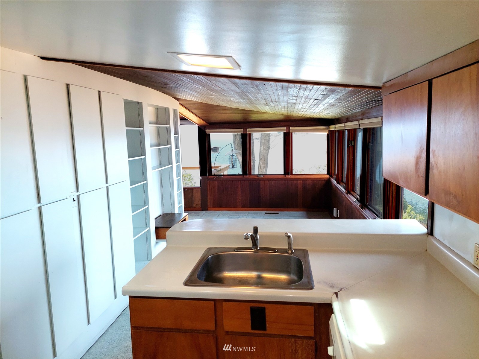9205 Olympic View Drive Edmonds, WA 98020 - Photo 20 of 25 a bathroom with a sink and a large mirror