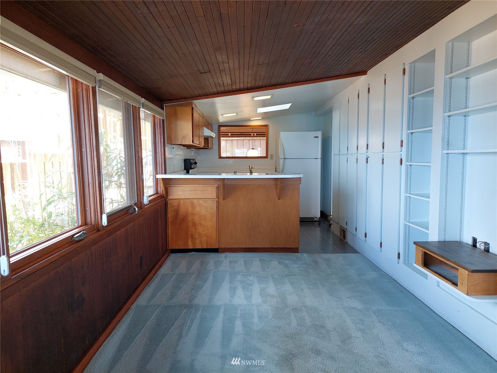 9205 Olympic View Drive Edmonds, WA 98020 - Photo 21 of 25 a view of a kitchen with wooden floor and electronic appliances