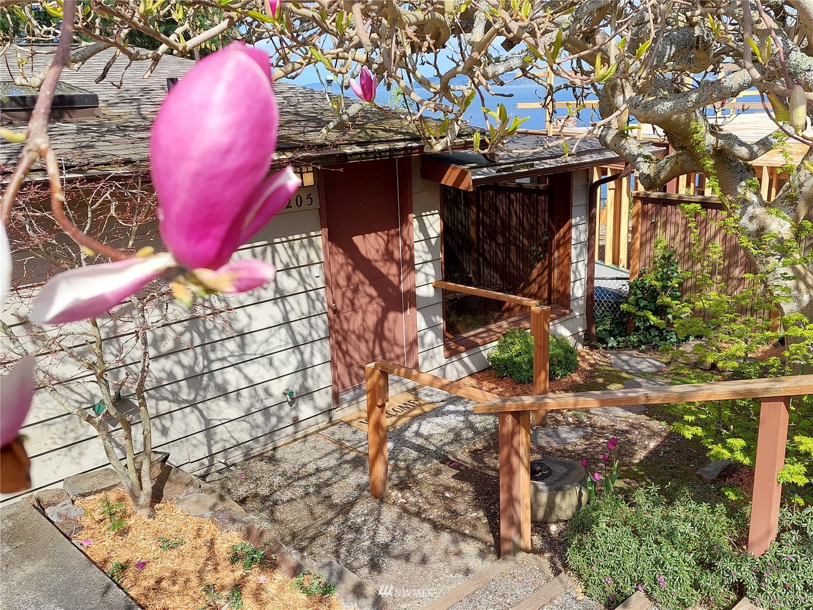 9205 Olympic View Drive Edmonds, WA 98020 - Photo 3 of 25 a view of a fireplace with a tree