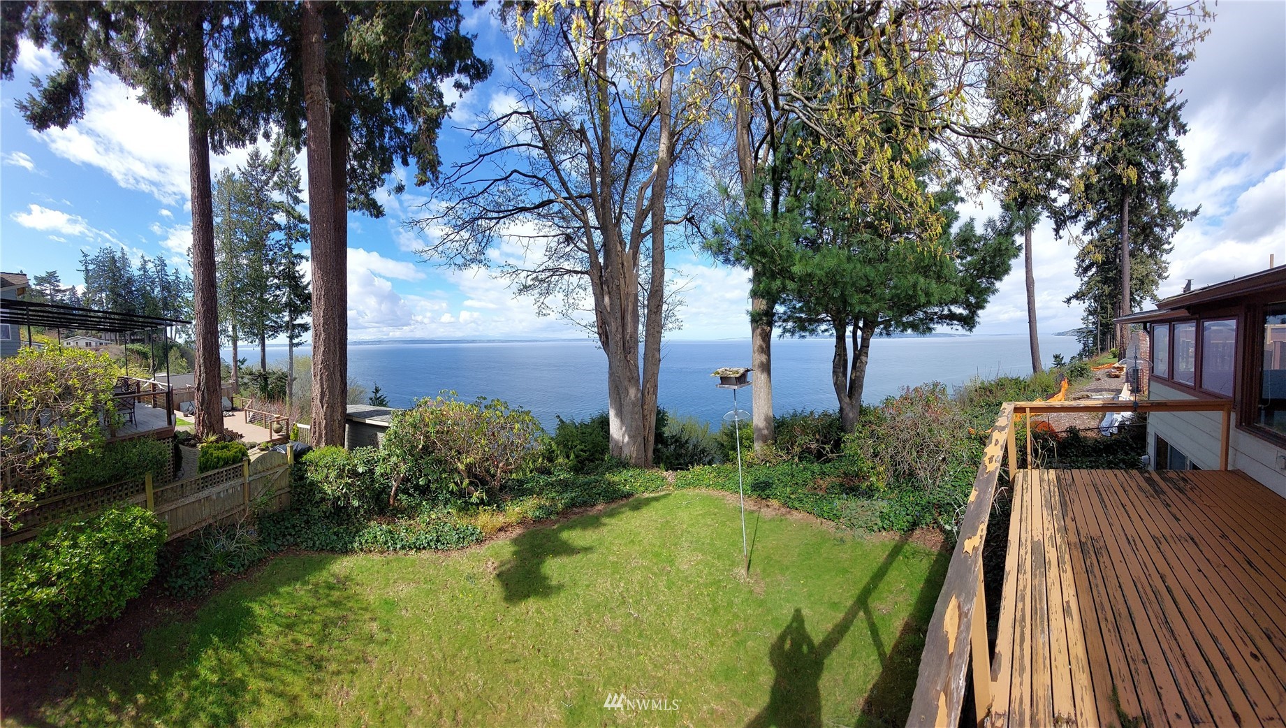 9205 Olympic View Drive Edmonds, WA 98020 - Photo 6 of 25 a backyard of a house with lots of green space and fountain