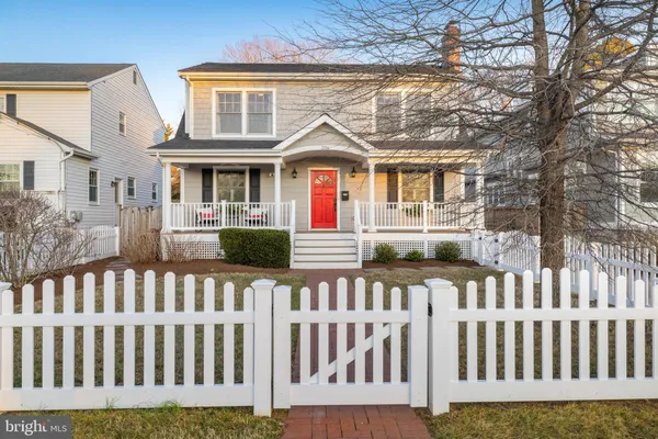 a view of a brick house with a small yard