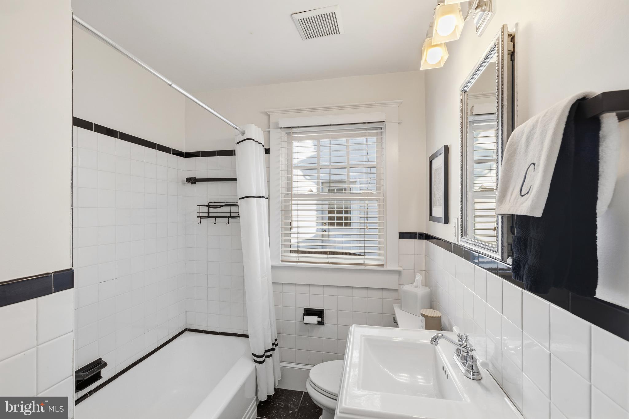 304 Locust Avenue Annapolis, MD 21401 - Photo 12 of 58 a bathroom with a sink a toilet and a bathtub