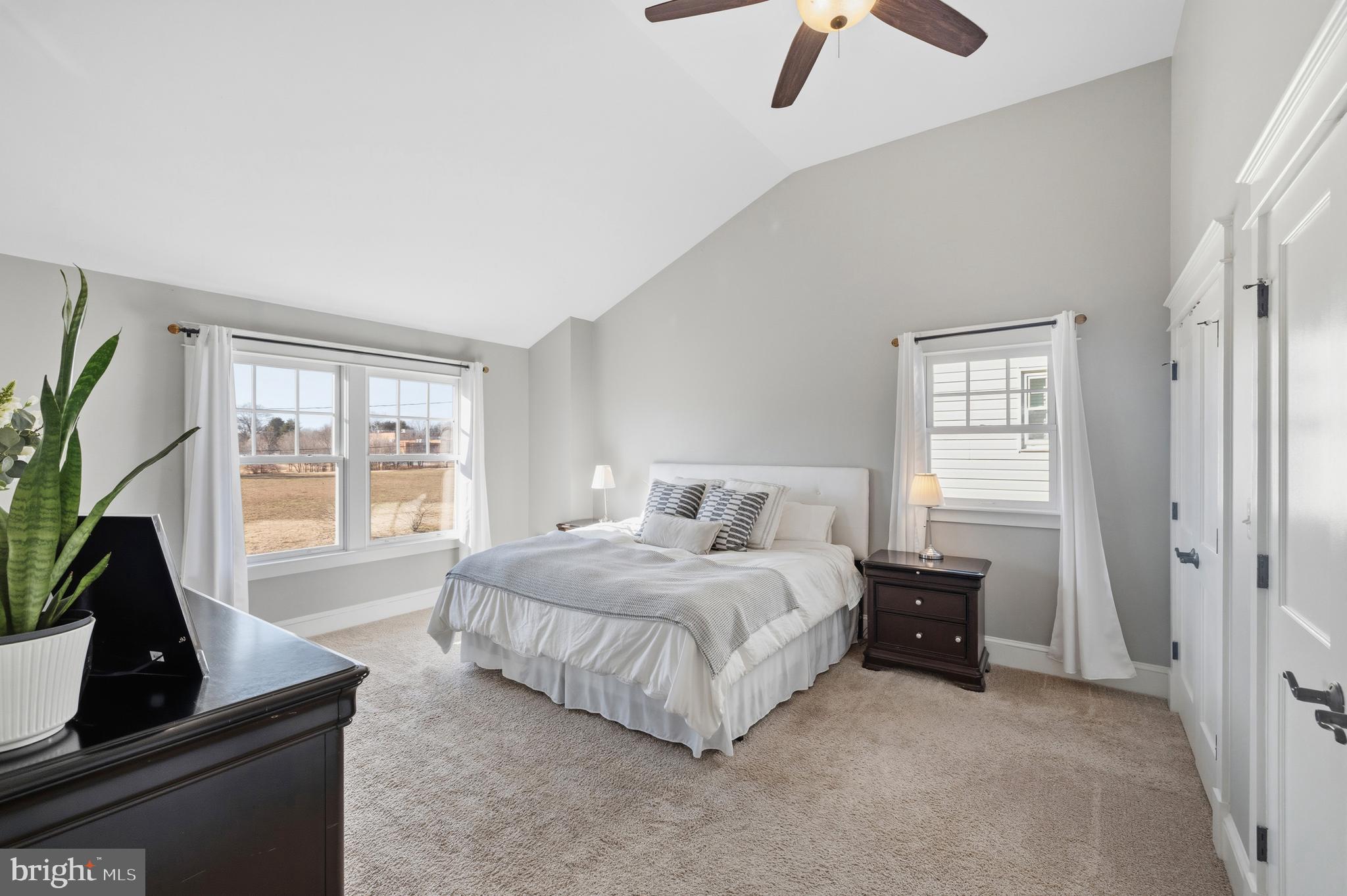 304 Locust Avenue Annapolis, MD 21401 - Photo 14 of 58 a bedroom with a bed a flat screen tv and a large window