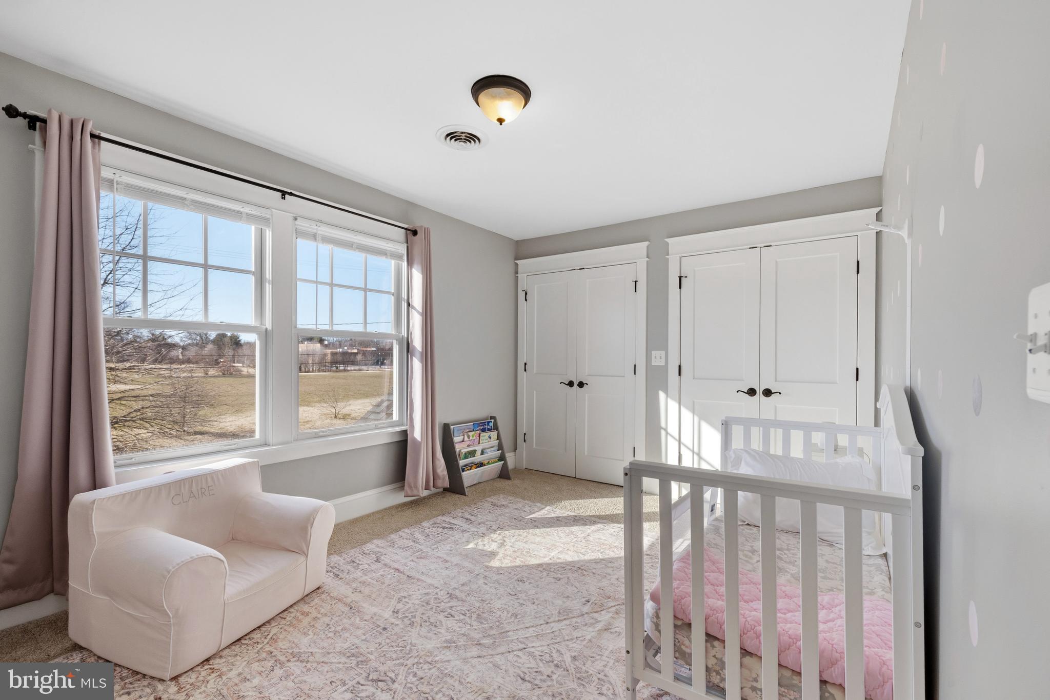 304 Locust Avenue Annapolis, MD 21401 - Photo 18 of 58 a spacious bedroom with a bed and glass window