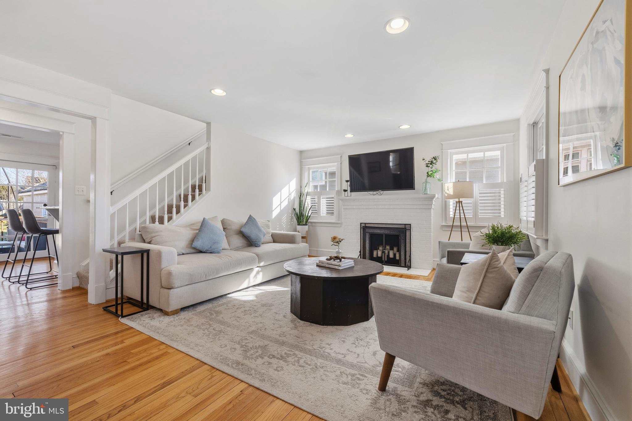 304 Locust Avenue Annapolis, MD 21401 - Photo 2 of 58 a living room with furniture a flat screen tv and a fireplace