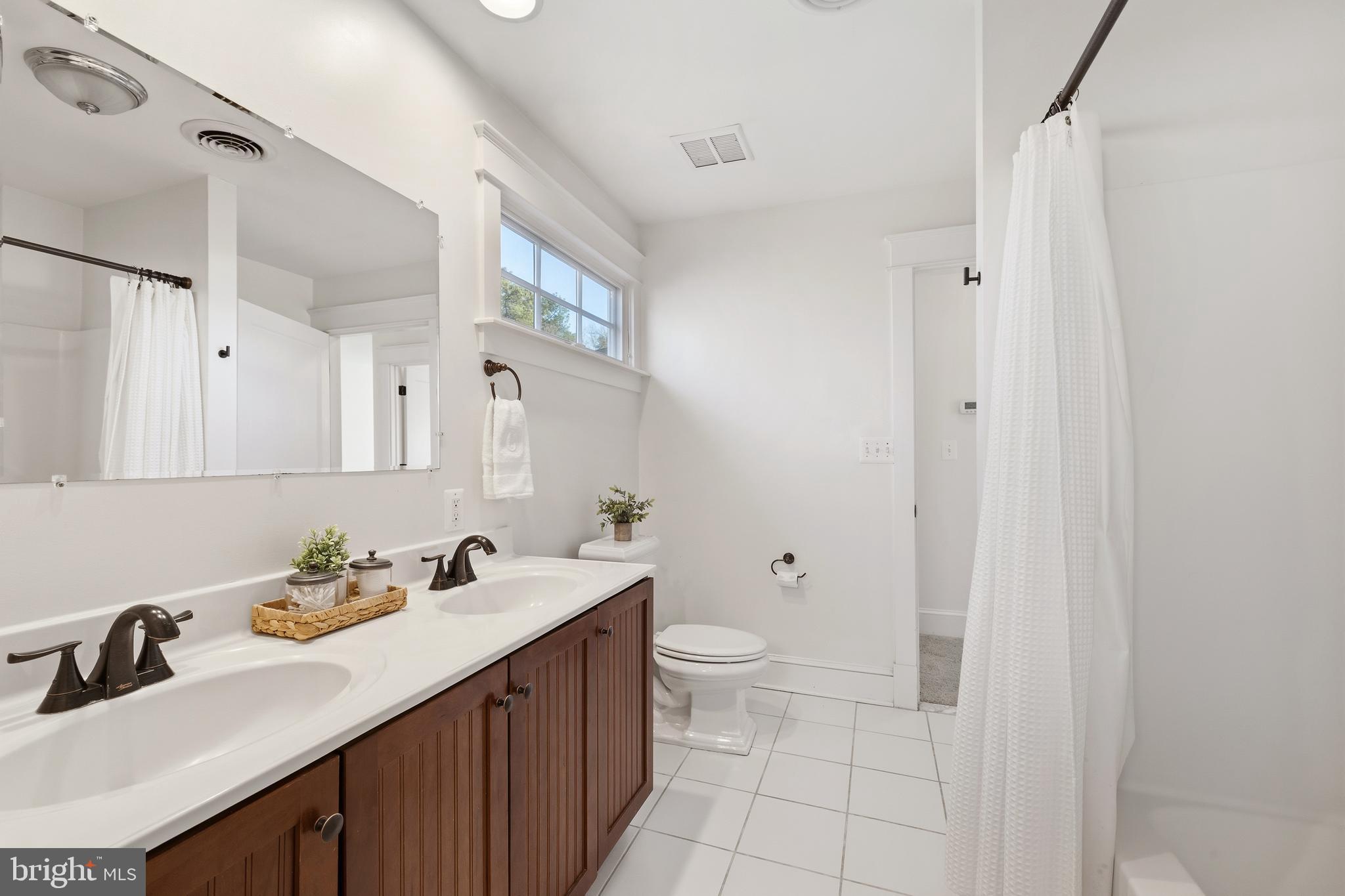 304 Locust Avenue Annapolis, MD 21401 - Photo 23 of 58 a bathroom with a sink toilet and vanity