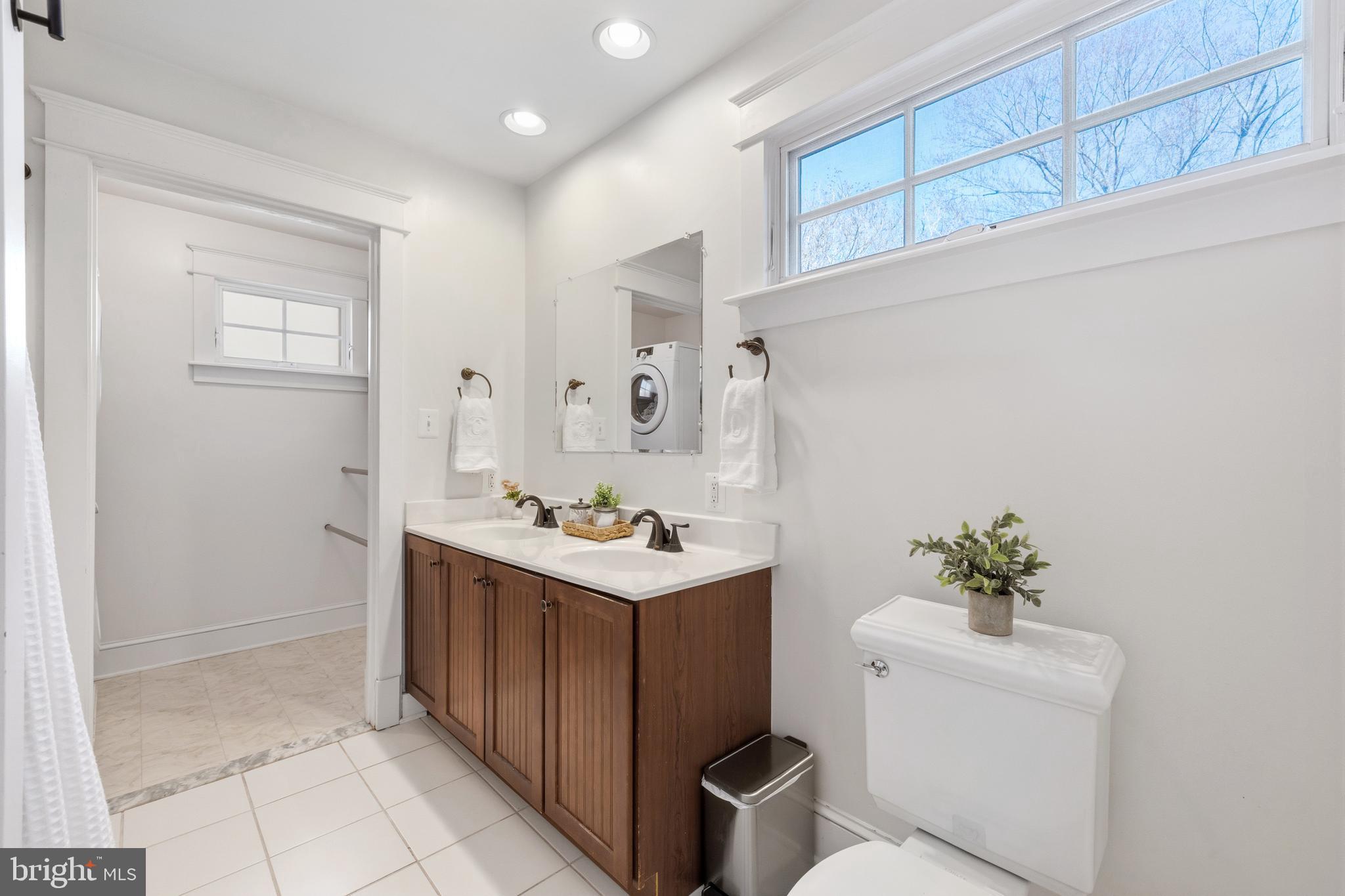 304 Locust Avenue Annapolis, MD 21401 - Photo 24 of 58 a bathroom with a sink toilet and shower