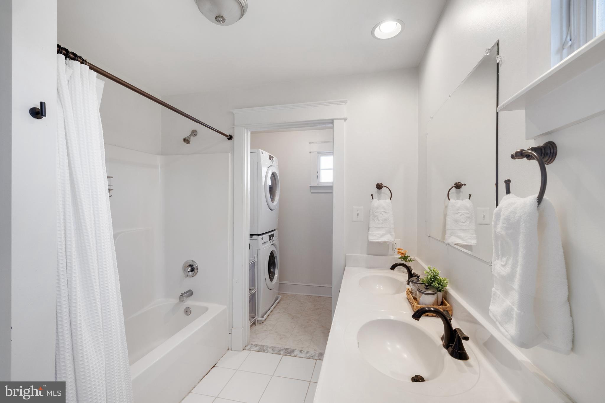304 Locust Avenue Annapolis, MD 21401 - Photo 25 of 58 a bathroom with a tub sink and shower