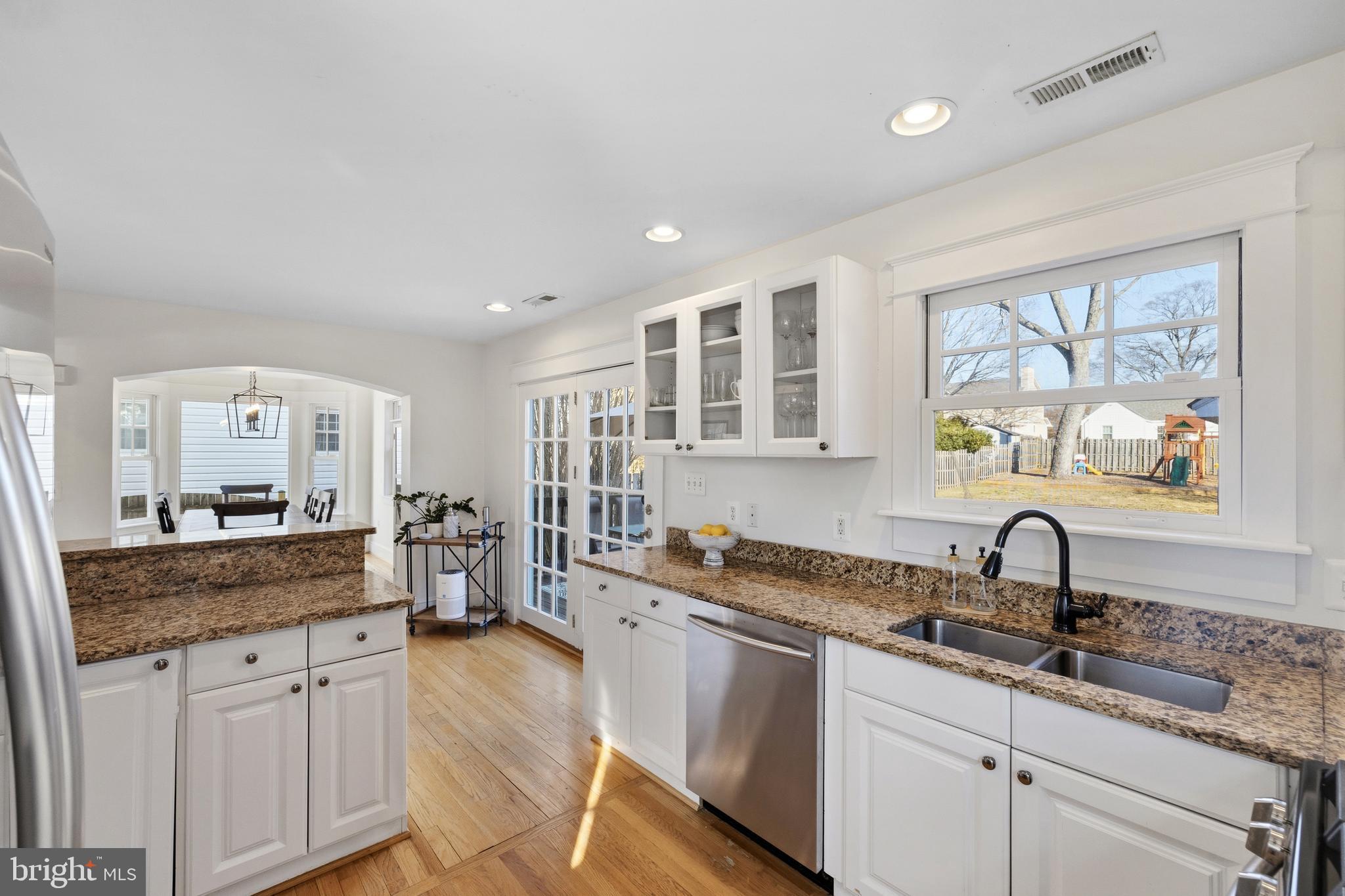 304 Locust Avenue Annapolis, MD 21401 - Photo 7 of 58 a kitchen with granite countertop a sink and cabinets