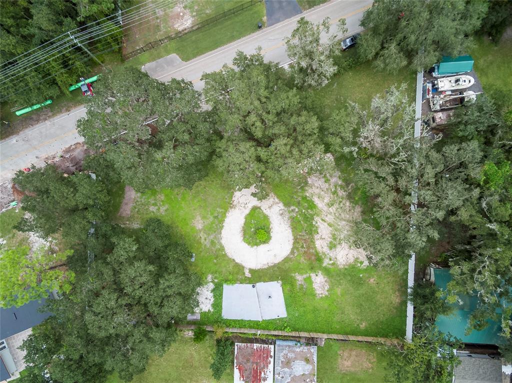 an aerial view of a house with yard swimming pool and outdoor seating
