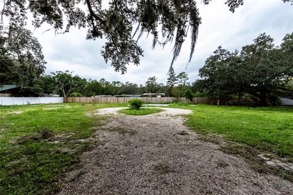 1550 South Tanner Road Orlando, FL 32833 - Photo 4 of 9 a view of outdoor space with deck and trees