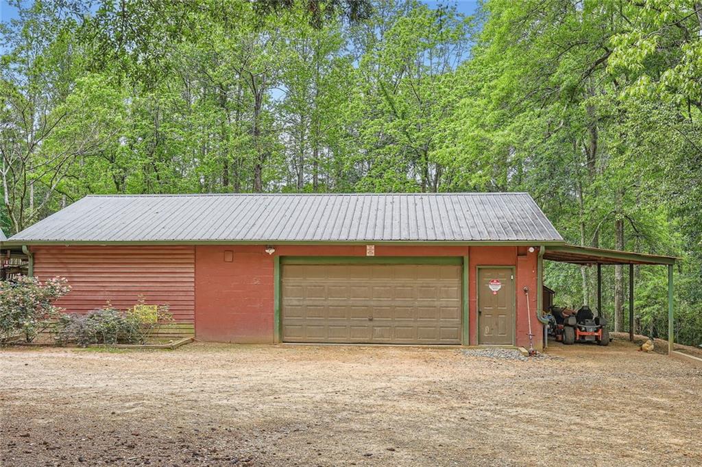 5419 Tyree Road Winston, GA 30187 - Photo 12 of 77 a front view of a house with a yard and garage