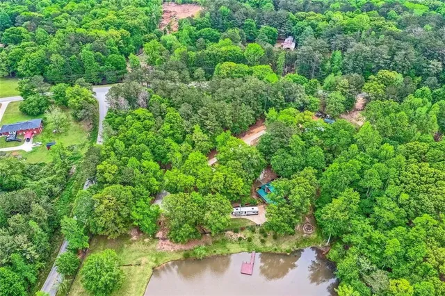 a living room with fireplace furniture and a flat screen tv