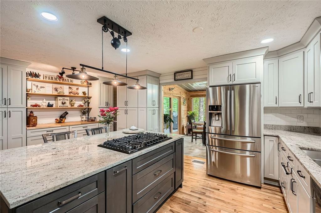 5419 Tyree Road Winston, GA 30187 - Photo 28 of 77 a kitchen with stainless steel appliances granite countertop a sink stove and refrigerator