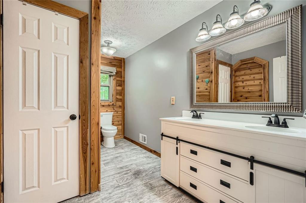 5419 Tyree Road Winston, GA 30187 - Photo 33 of 77 a spacious bathroom with a double vanity sink mirror and