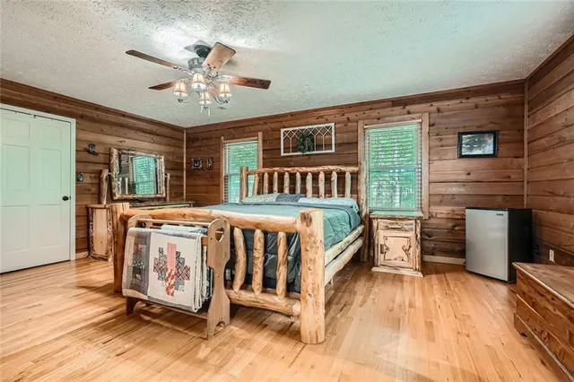 a living room with furniture a piano and a flat screen tv