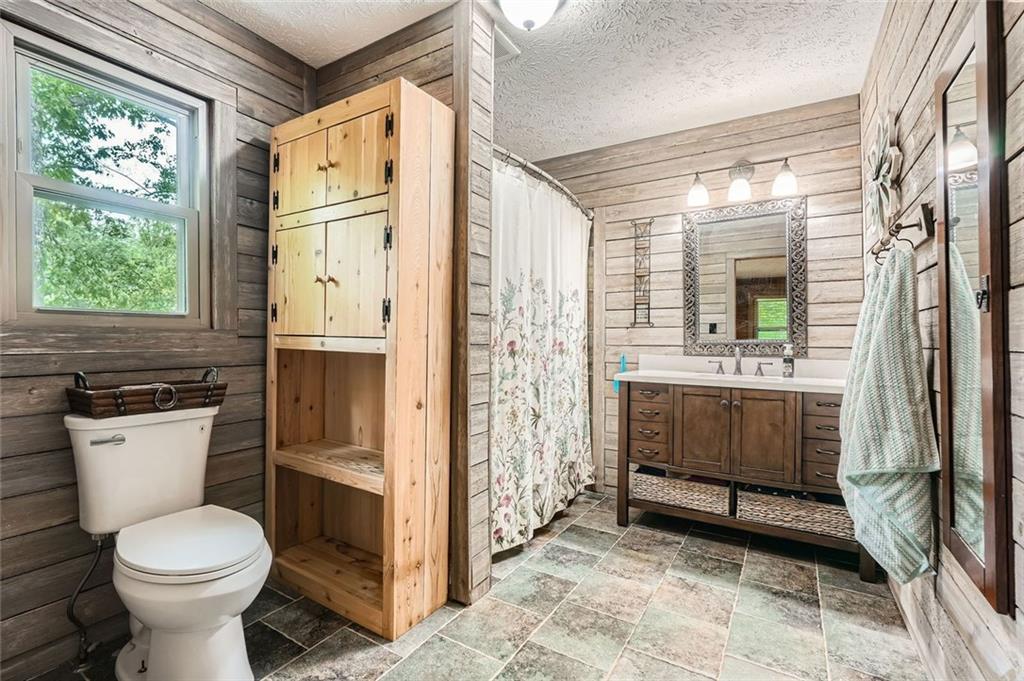 5419 Tyree Road Winston, GA 30187 - Photo 36 of 77 a bathroom with a sink a toilet and shower