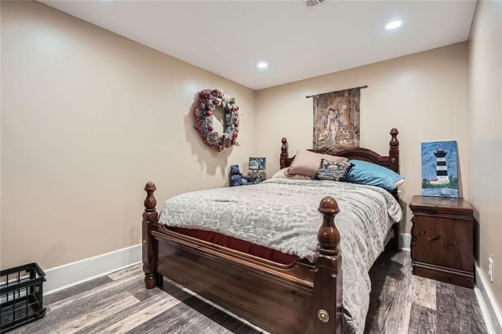 5419 Tyree Road Winston, GA 30187 - Photo 41 of 77 a bedroom with a bed and a painting on the wall