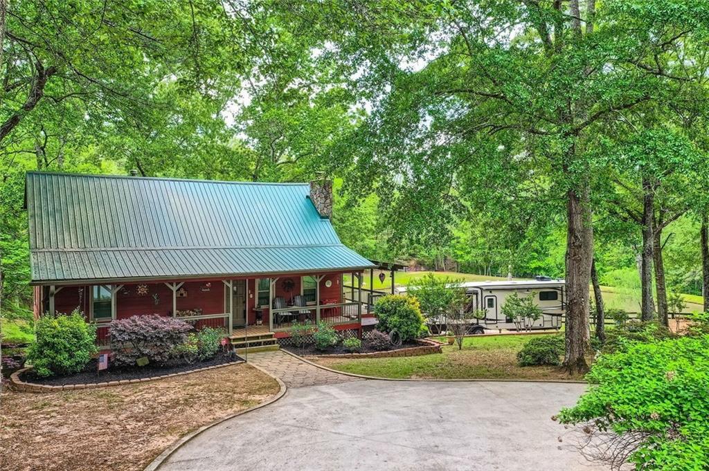 5419 Tyree Road Winston, GA 30187 - Photo 7 of 77 a front view of a house with garden