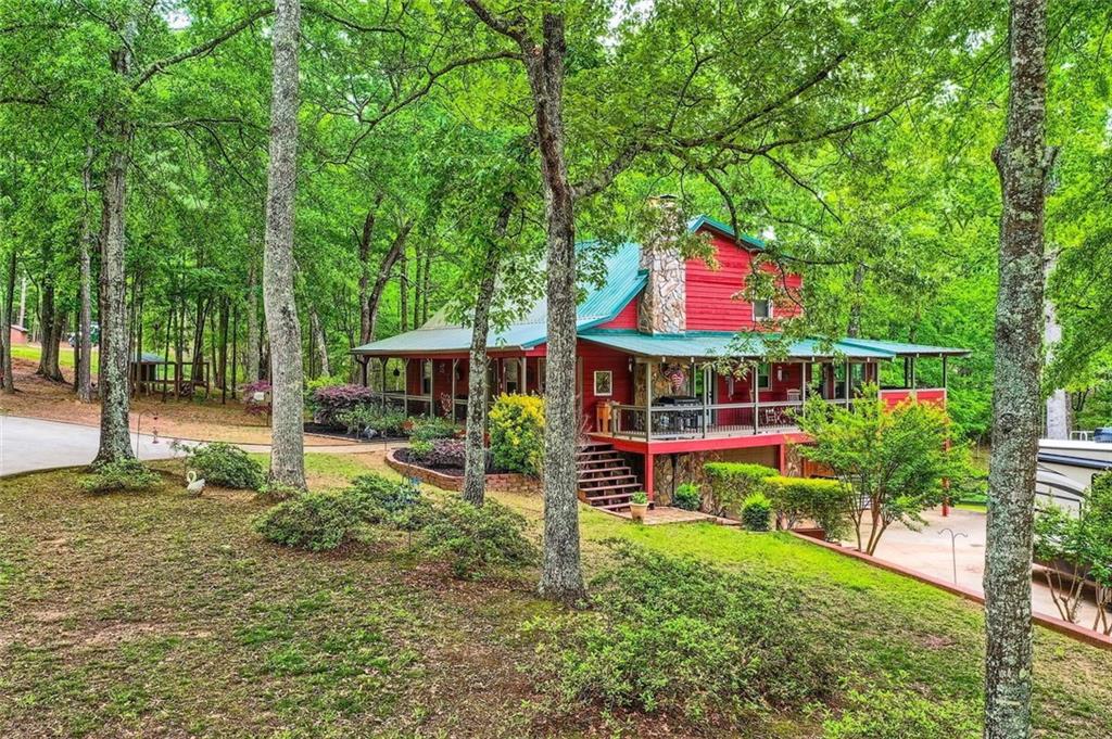 5419 Tyree Road Winston, GA 30187 - Photo 9 of 77 a view of an house with backyard and sitting area
