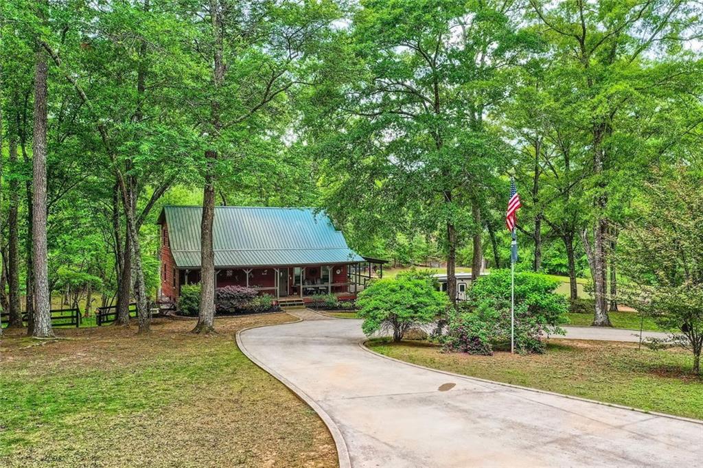 5419 Tyree Road Winston, GA 30187 - Photo 10 of 77 a house with trees in front of it