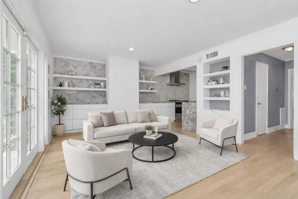 an aerial view of residential houses with city view