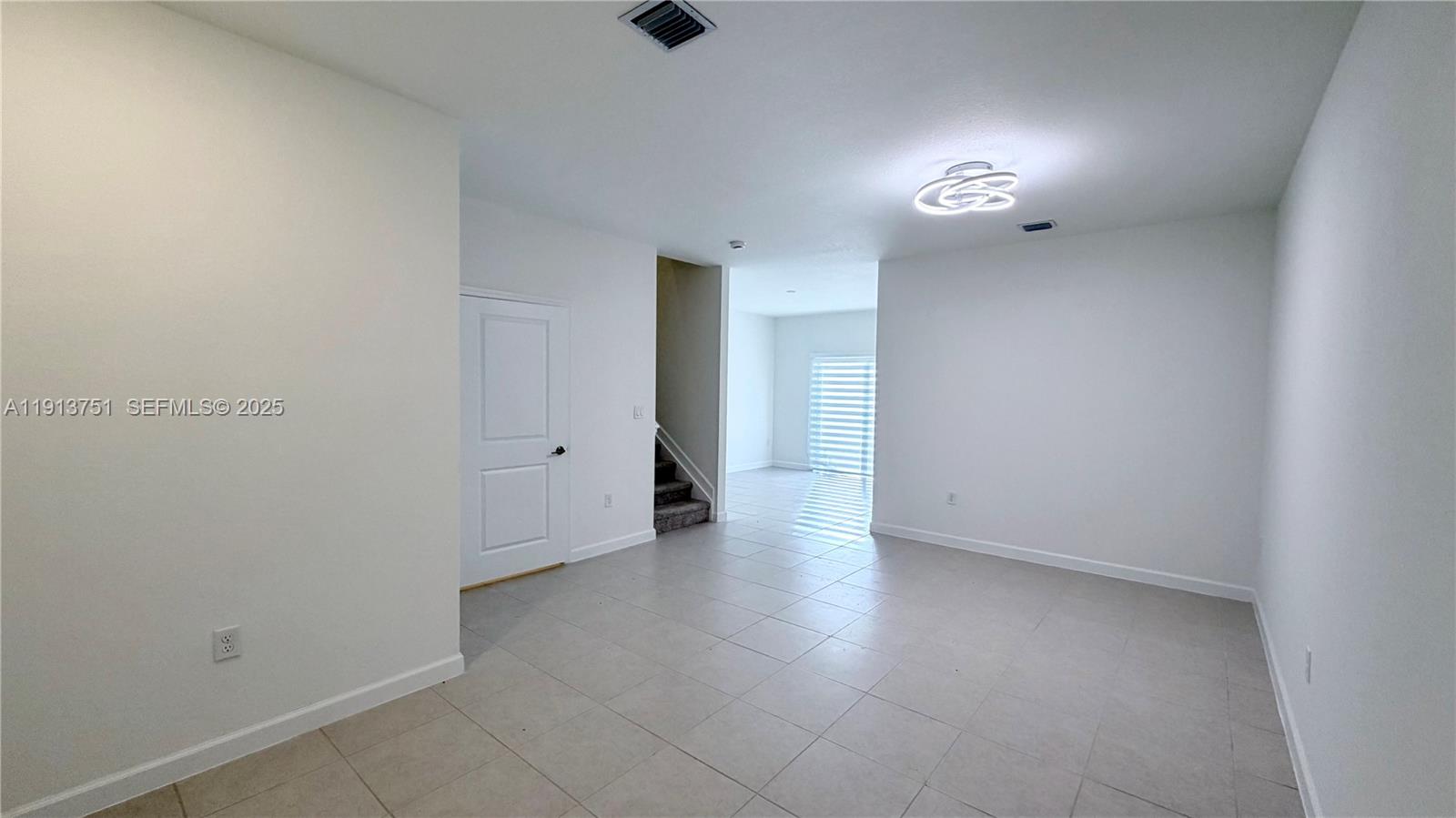 23250 Southwest 133rd Court Homestead, FL 33032 - Photo 12 of 31 wooden floor in an empty room