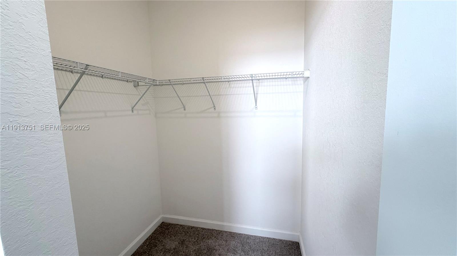 23250 Southwest 133rd Court Homestead, FL 33032 - Photo 15 of 31 a view of a room with racks on the wall