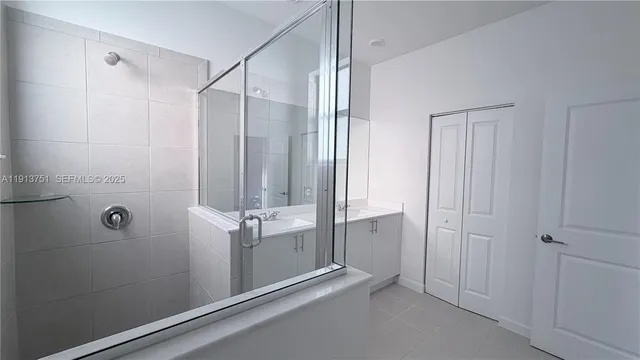 a bathroom with a shower and a tub