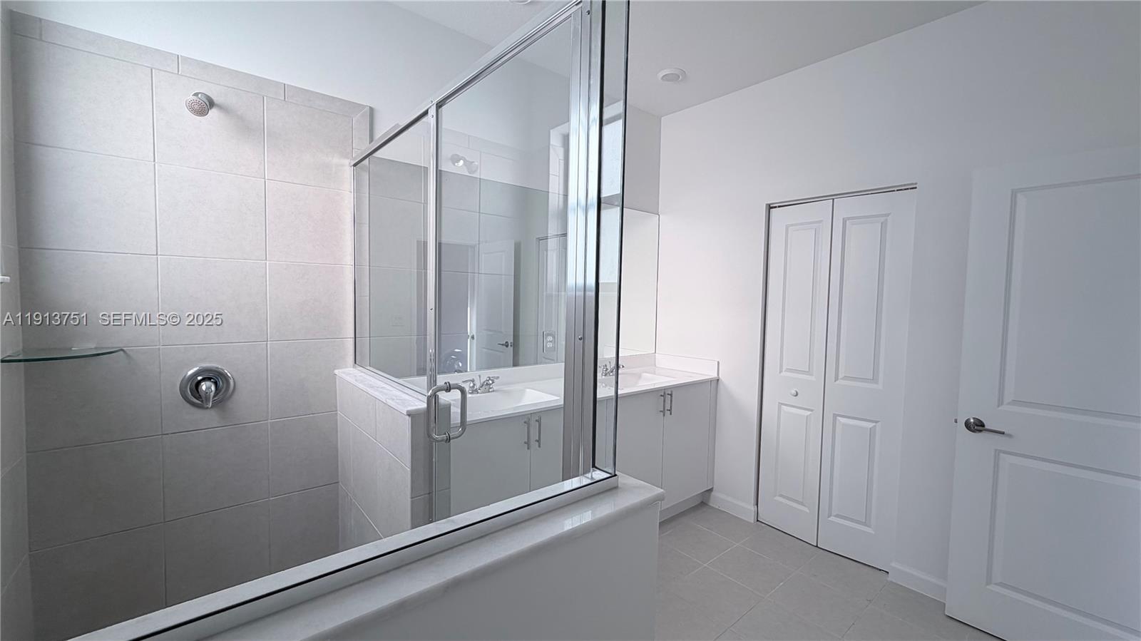 23250 Southwest 133rd Court Homestead, FL 33032 - Photo 16 of 31 a bathroom with a shower and a tub