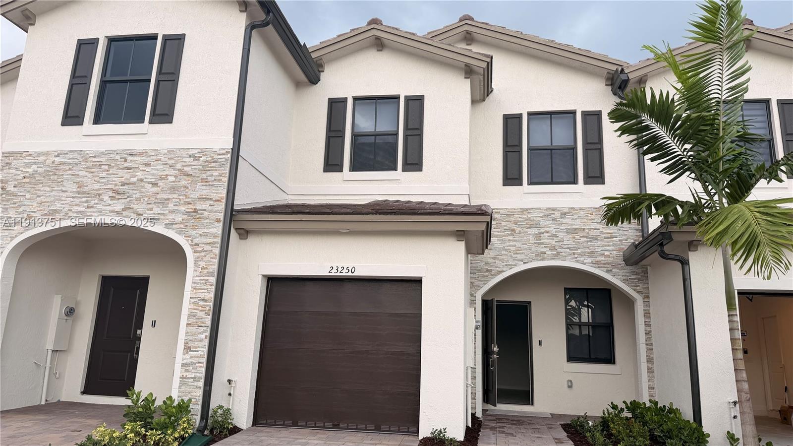23250 Southwest 133rd Court Homestead, FL 33032 - Photo 2 of 31 a front view of a house with plants