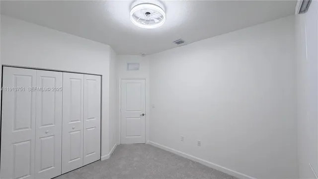 an empty room with a cupboard