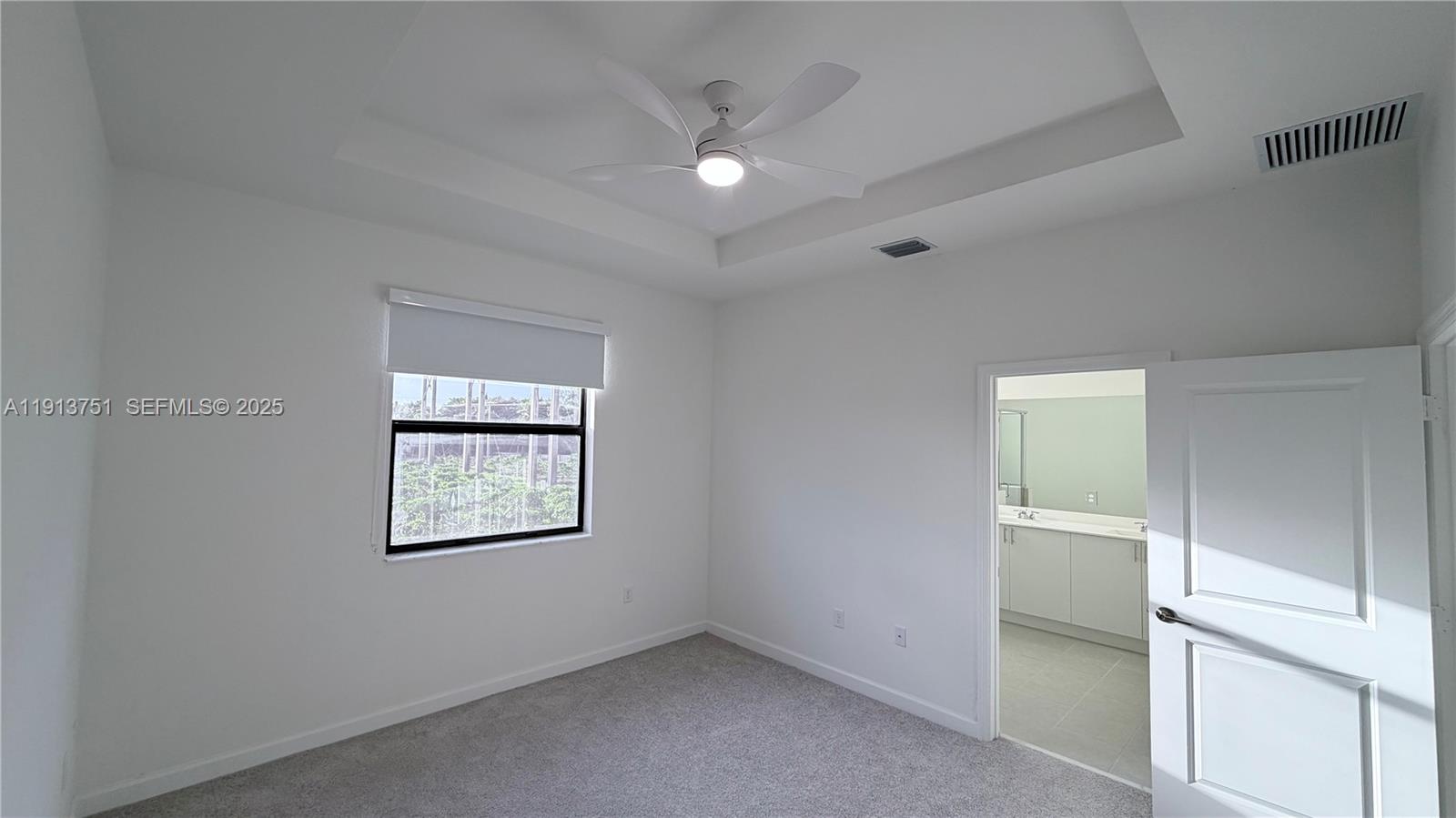 23250 Southwest 133rd Court Homestead, FL 33032 - Photo 26 of 31 an empty room with a window