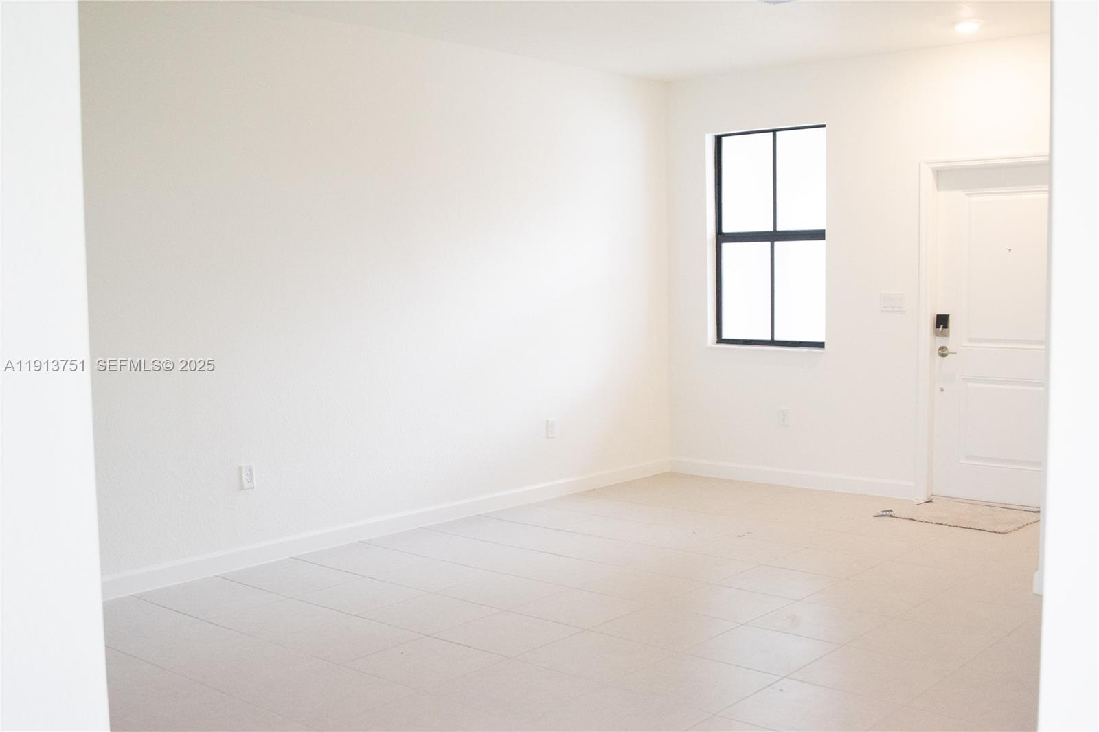 23250 Southwest 133rd Court Homestead, FL 33032 - Photo 7 of 31 an empty room with a window
