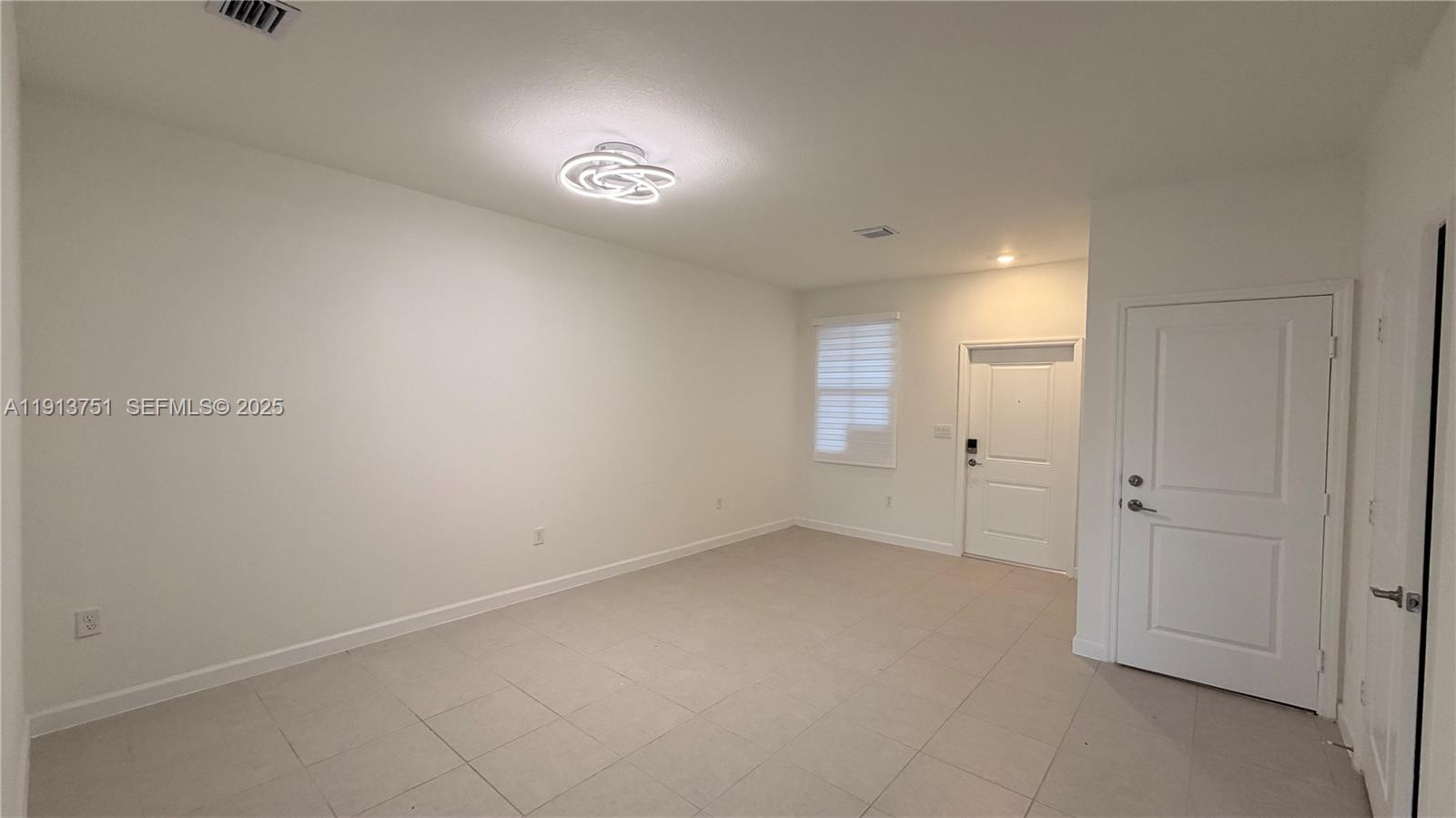 23250 Southwest 133rd Court Homestead, FL 33032 - Photo 10 of 31 a view of an empty room and a window