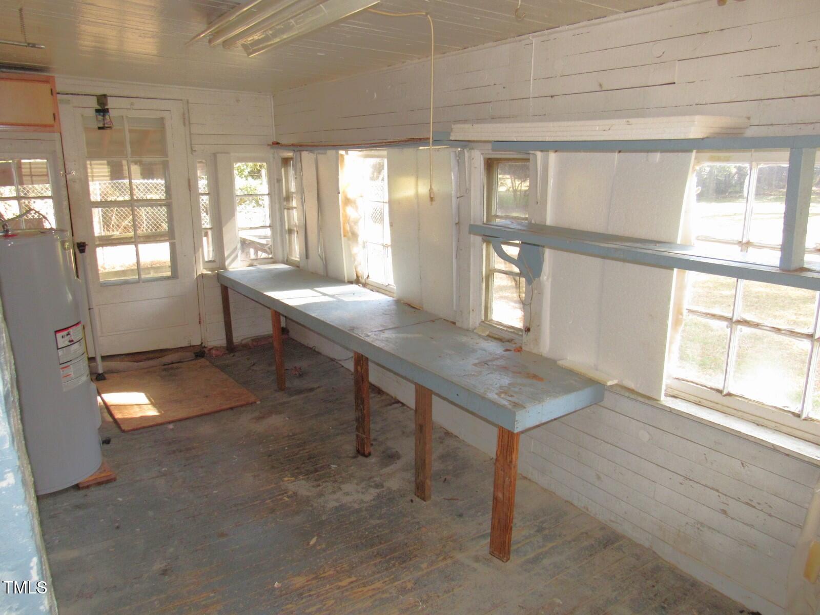 3518 Cheek Road Durham, NC 27704 - Photo 13 of 38 a room with lots of furniture and a large window