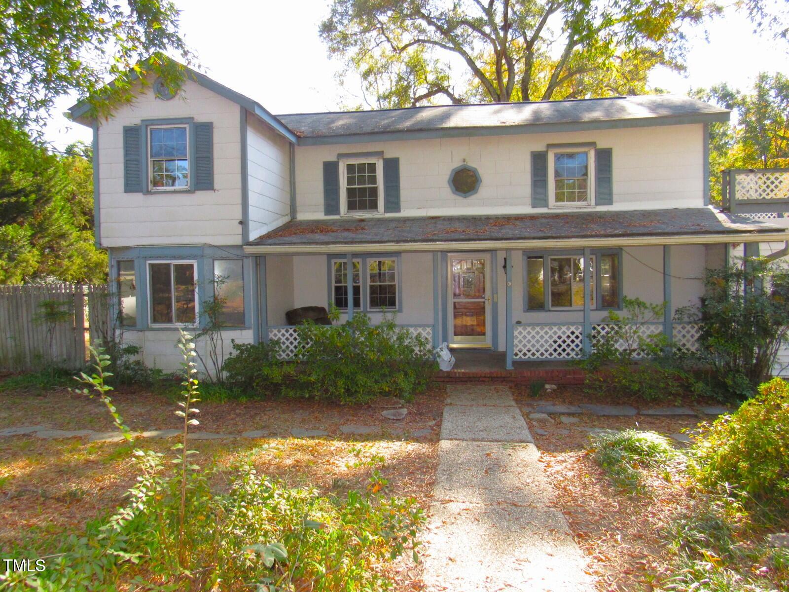 3518 Cheek Road Durham, NC 27704 - Photo 2 of 38 front view of a house with a yard