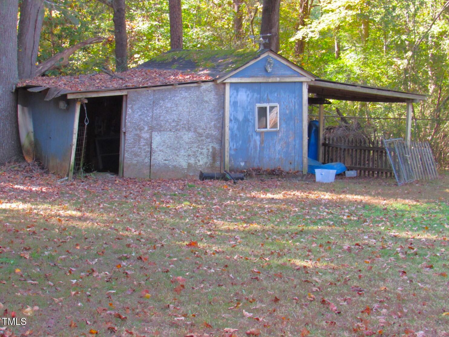 3518 Cheek Road Durham, NC 27704 - Photo 22 of 38 a front view of a house with a yard and garage