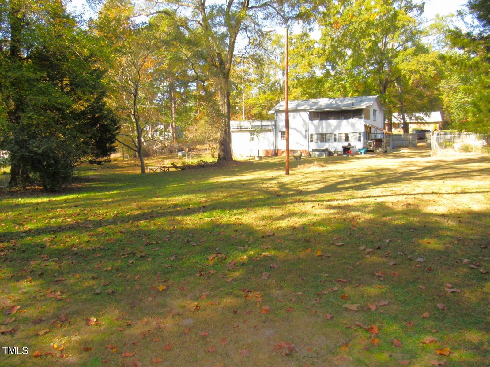 3518 Cheek Road Durham, NC 27704 - Photo 26 of 38 a view of a swimming pool with an outdoor space