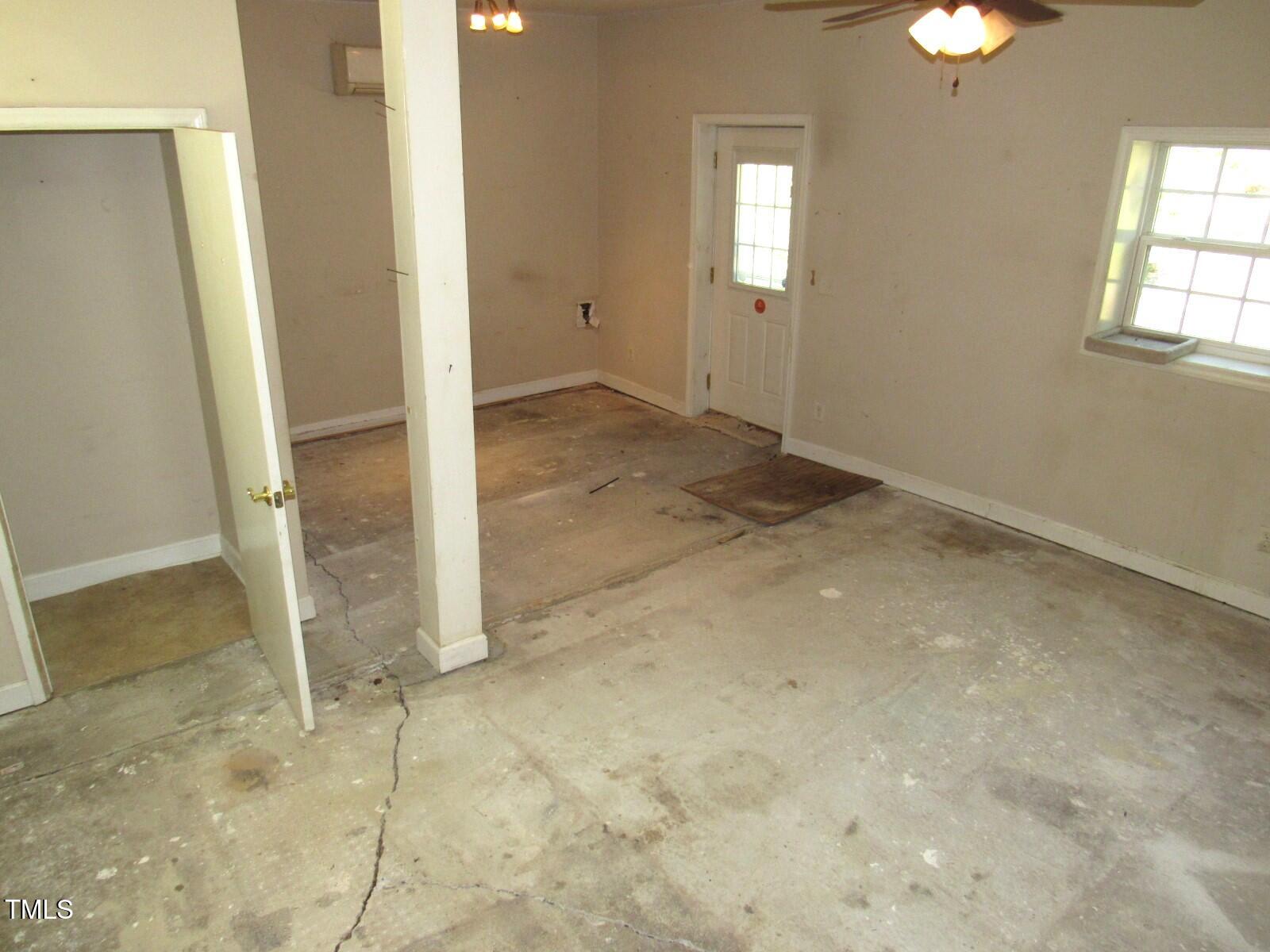 3518 Cheek Road Durham, NC 27704 - Photo 7 of 38 an empty room with windows