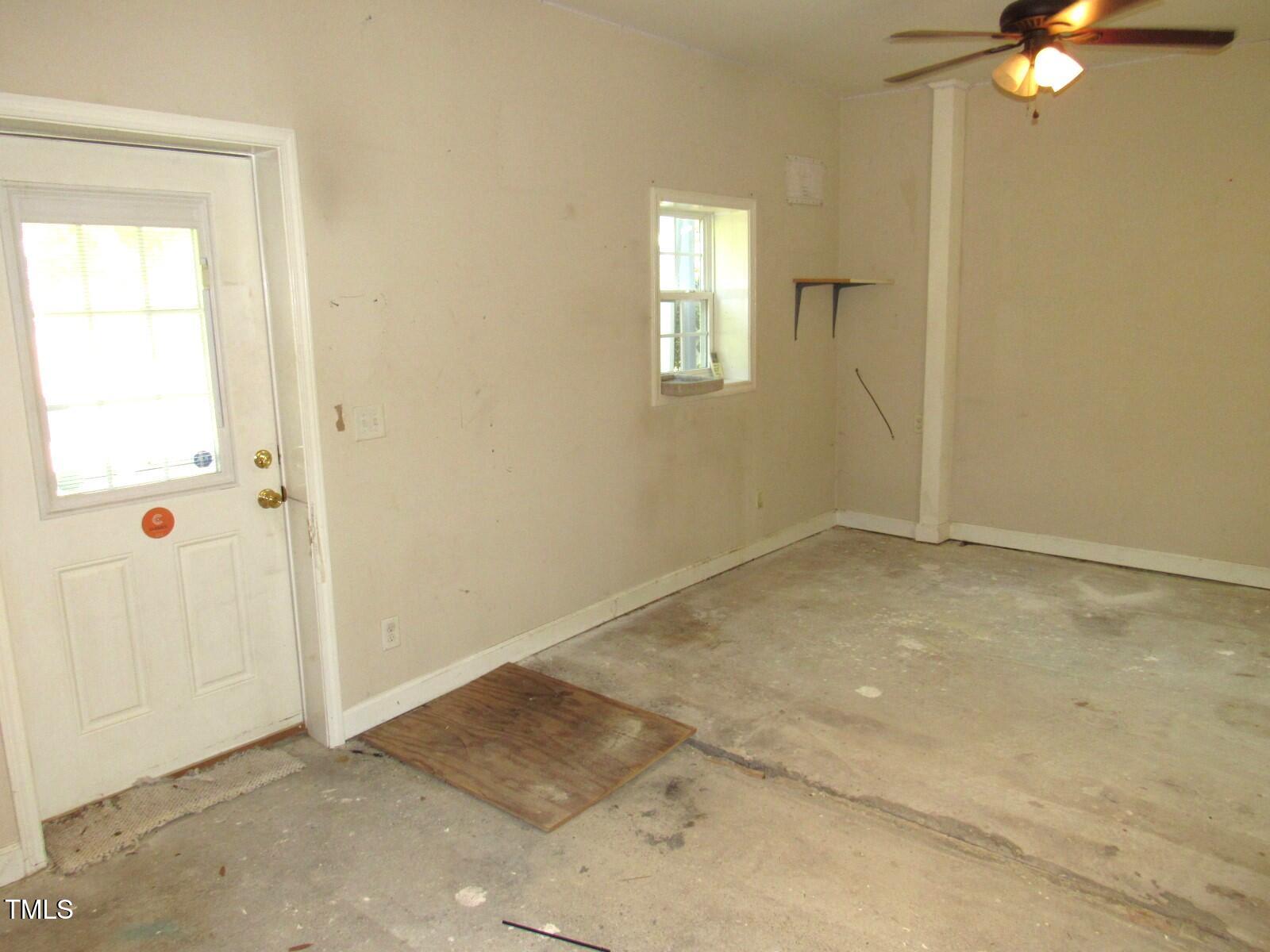 3518 Cheek Road Durham, NC 27704 - Photo 9 of 38 an empty room with windows