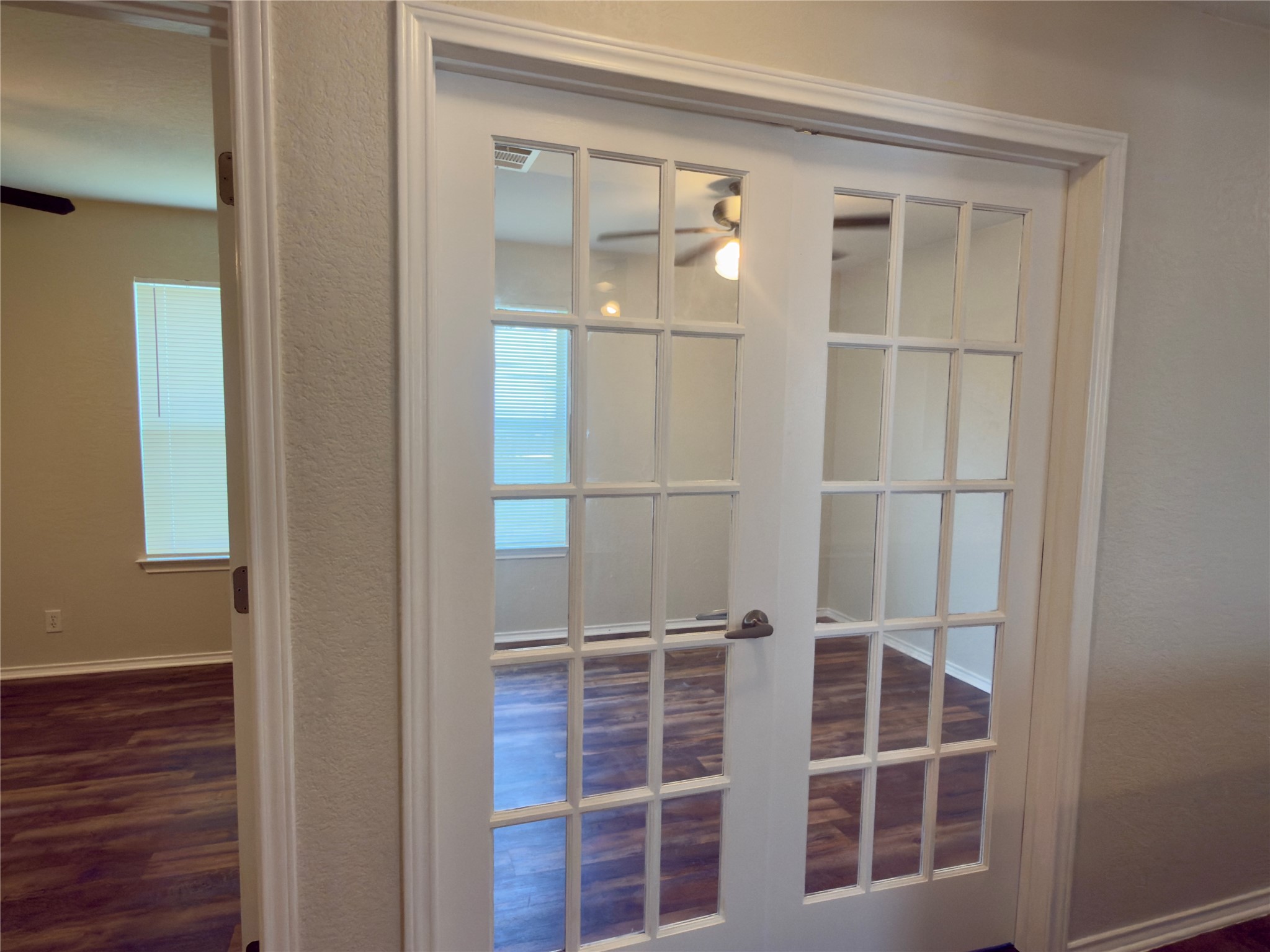255 Myrtle Street Kyle, TX 78640 - Photo 13 of 31 Double French doors with multipane glass, a classic white finish, and a polished metal handle