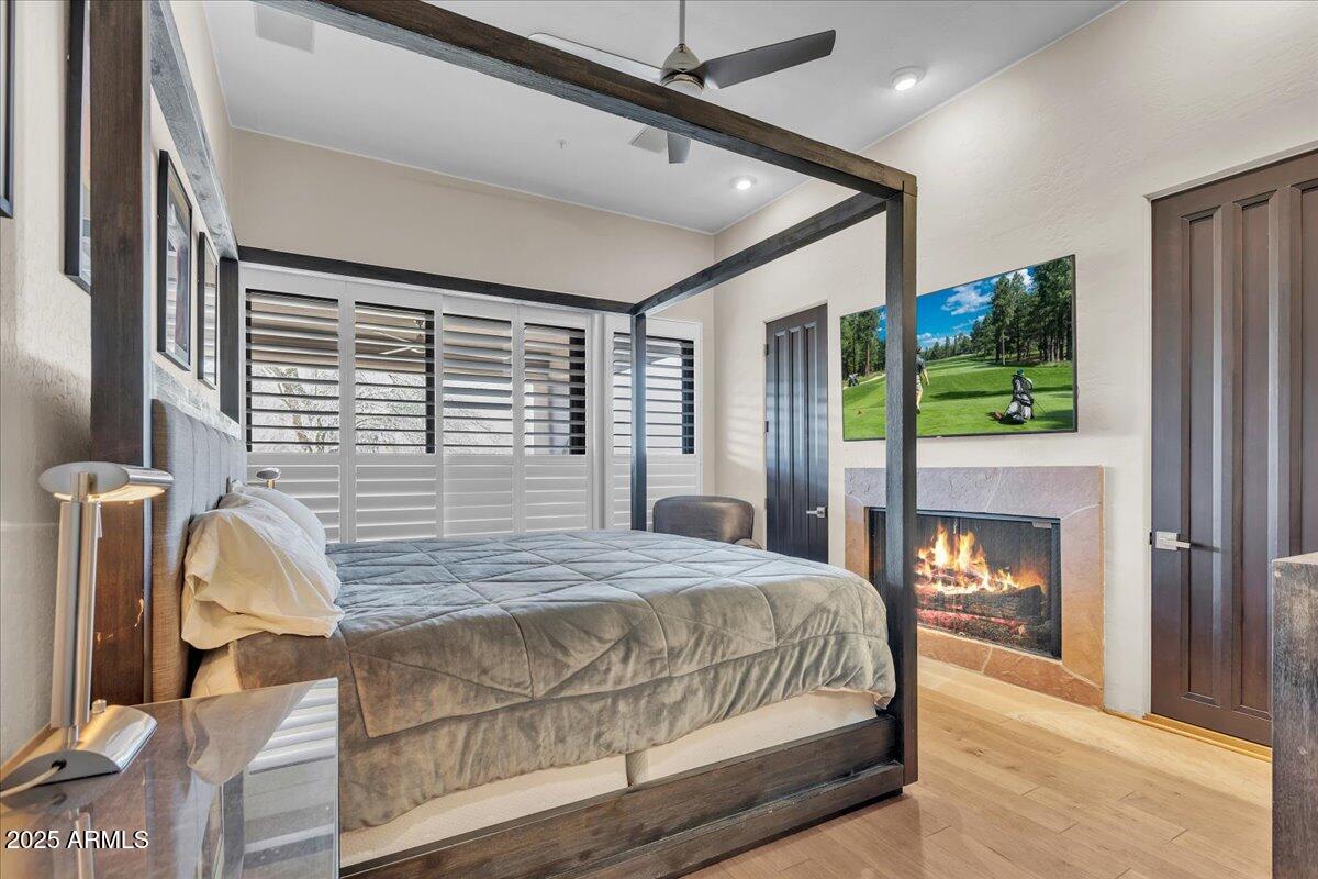 10040 East Happy Valley Road, Unit 300 Scottsdale, AZ 85255 - Photo 10 of 92 a bedroom with a bed window and mirror