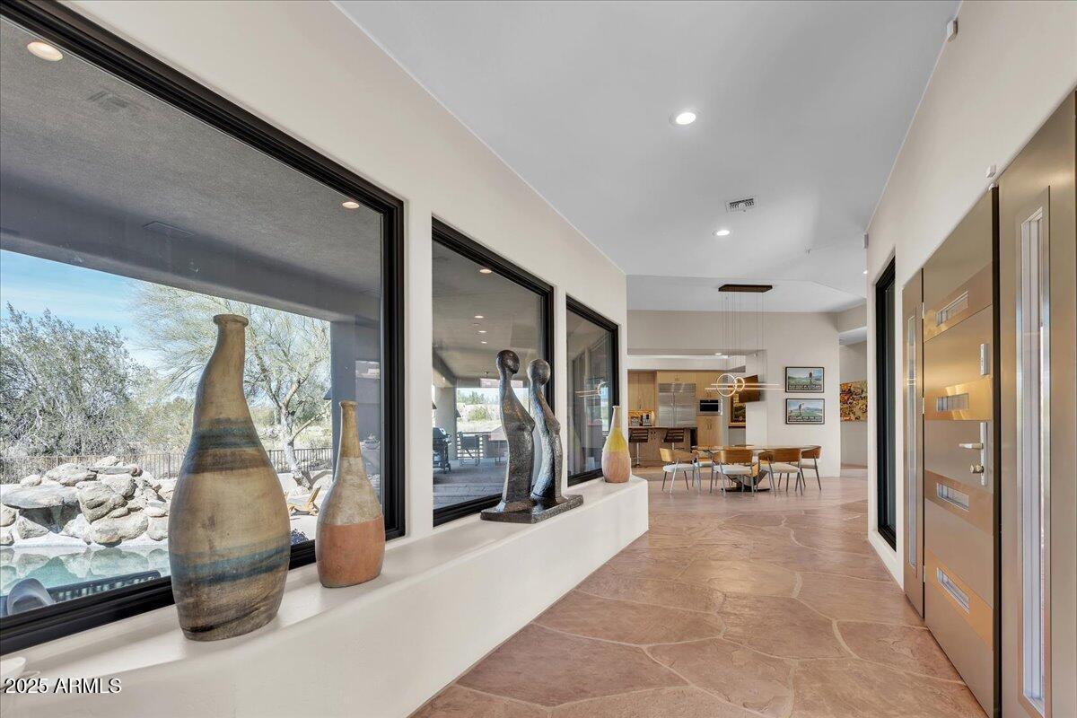 10040 East Happy Valley Road, Unit 300 Scottsdale, AZ 85255 - Photo 15 of 92 a view of a hallway with living room and furniture