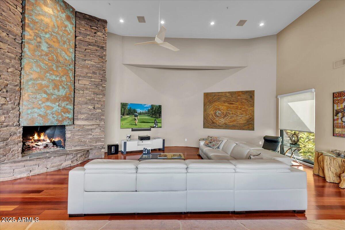 10040 East Happy Valley Road, Unit 300 Scottsdale, AZ 85255 - Photo 17 of 92 a living room with furniture and a fireplace