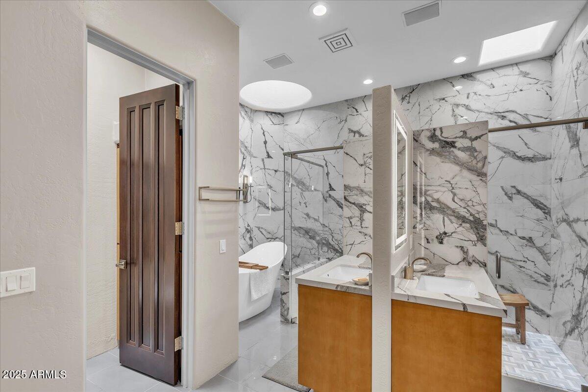 10040 East Happy Valley Road, Unit 300 Scottsdale, AZ 85255 - Photo 27 of 92 a bathroom with a granite countertop sink a toilet and shower