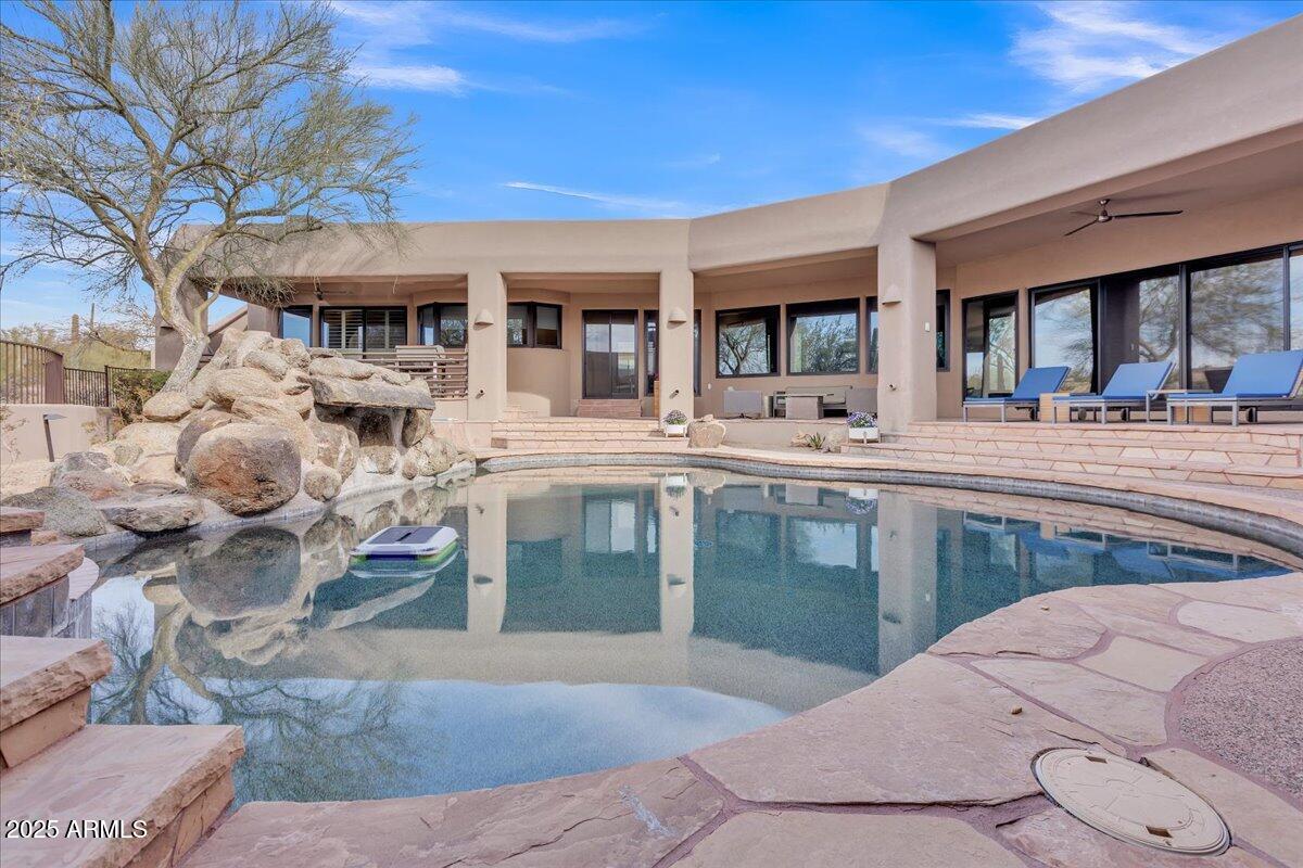 10040 East Happy Valley Road, Unit 300 Scottsdale, AZ 85255 - Photo 3 of 92 Pool, spa, and waterfall