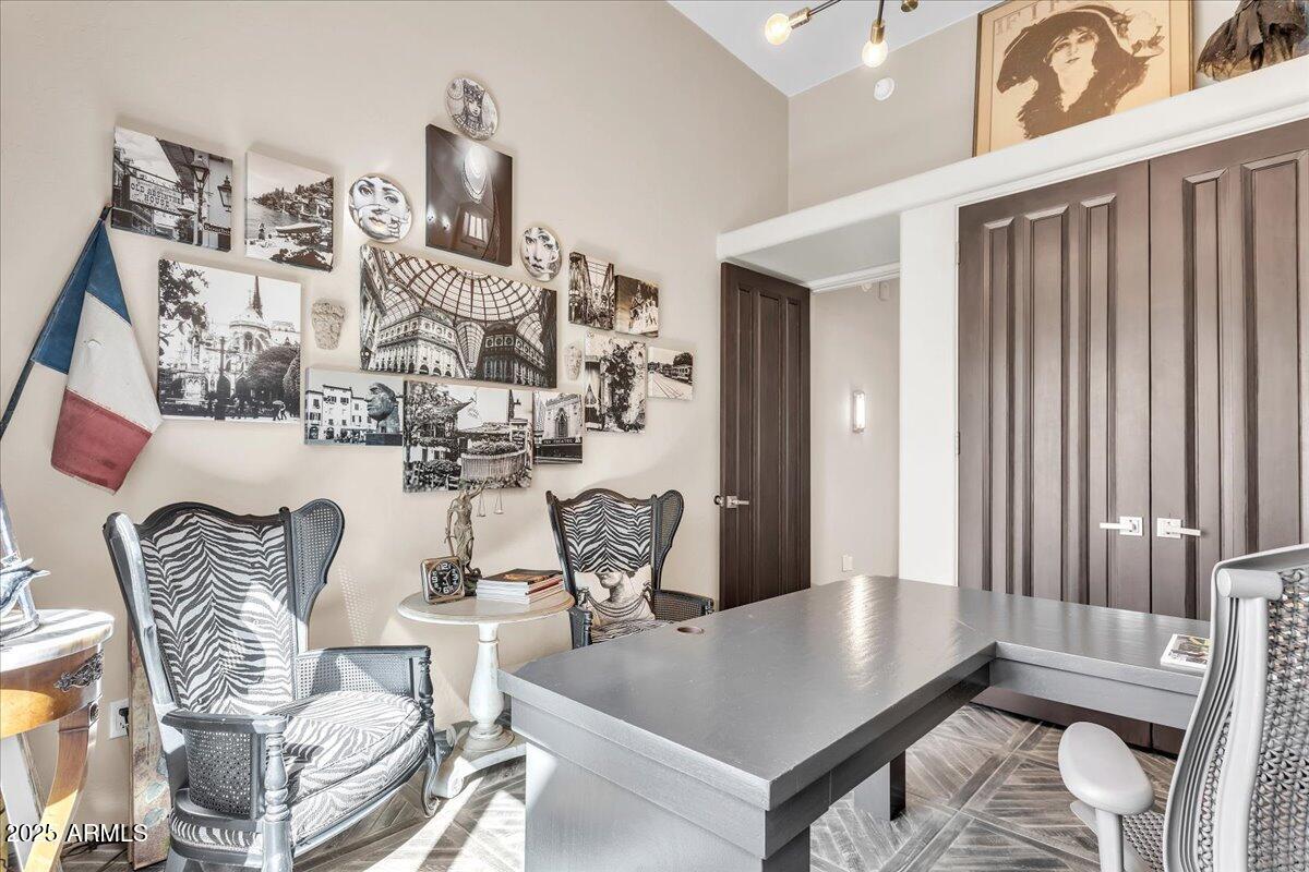 10040 East Happy Valley Road, Unit 300 Scottsdale, AZ 85255 - Photo 44 of 92 a living room with furniture and wooden floor