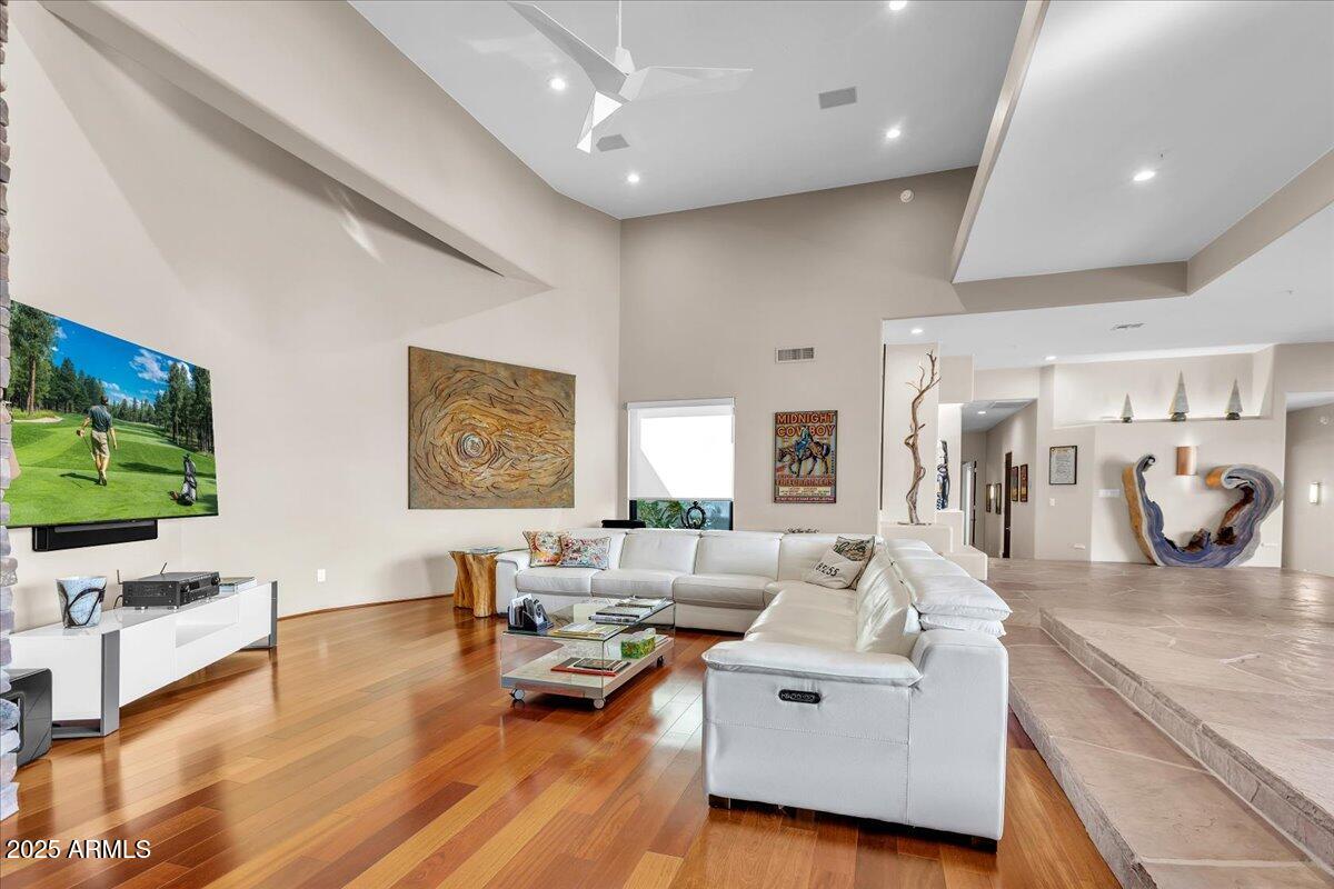 10040 East Happy Valley Road, Unit 300 Scottsdale, AZ 85255 - Photo 47 of 92 a living room with furniture and a flat screen tv